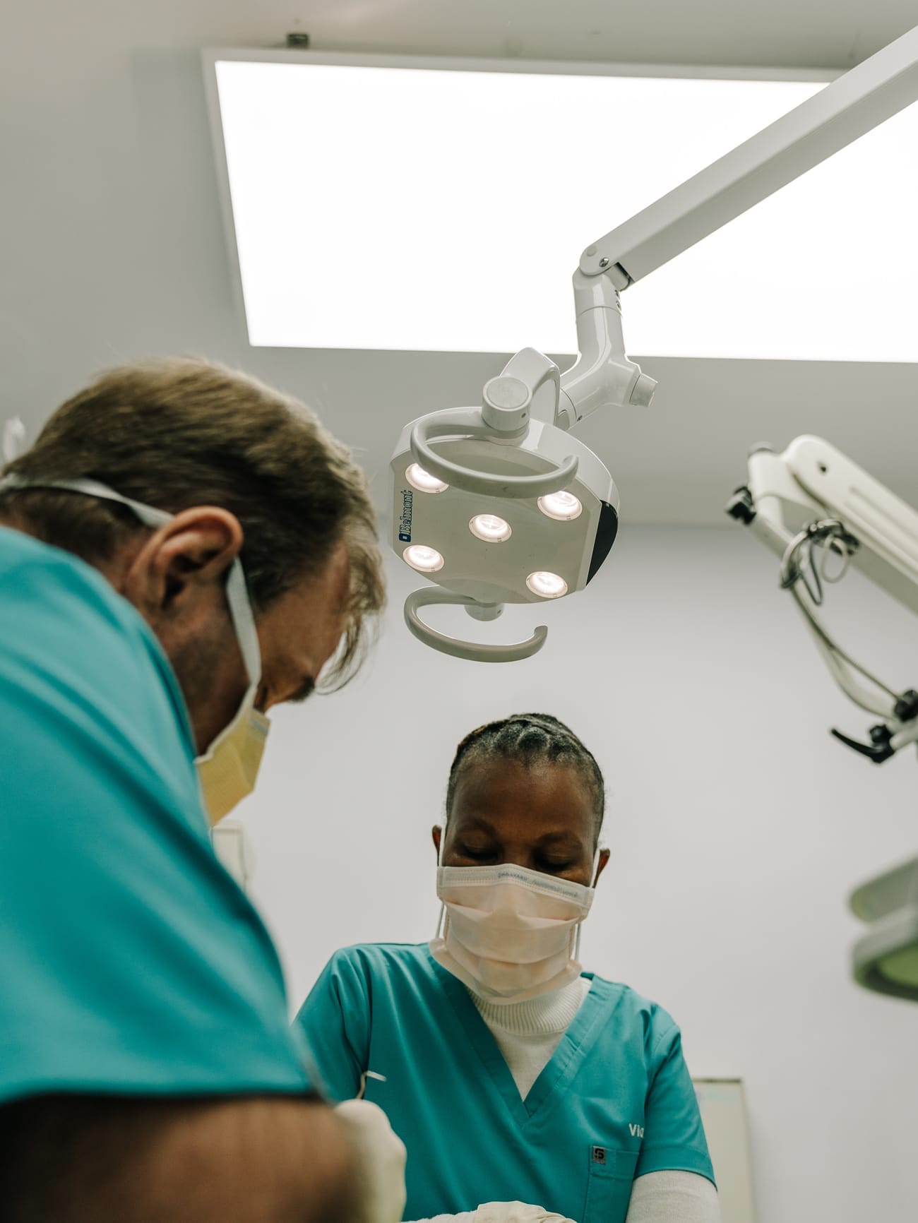Dr Eugene Kleynhans and a dental assistant treating a patient at Smile Connection Dental Studio, Pretoria