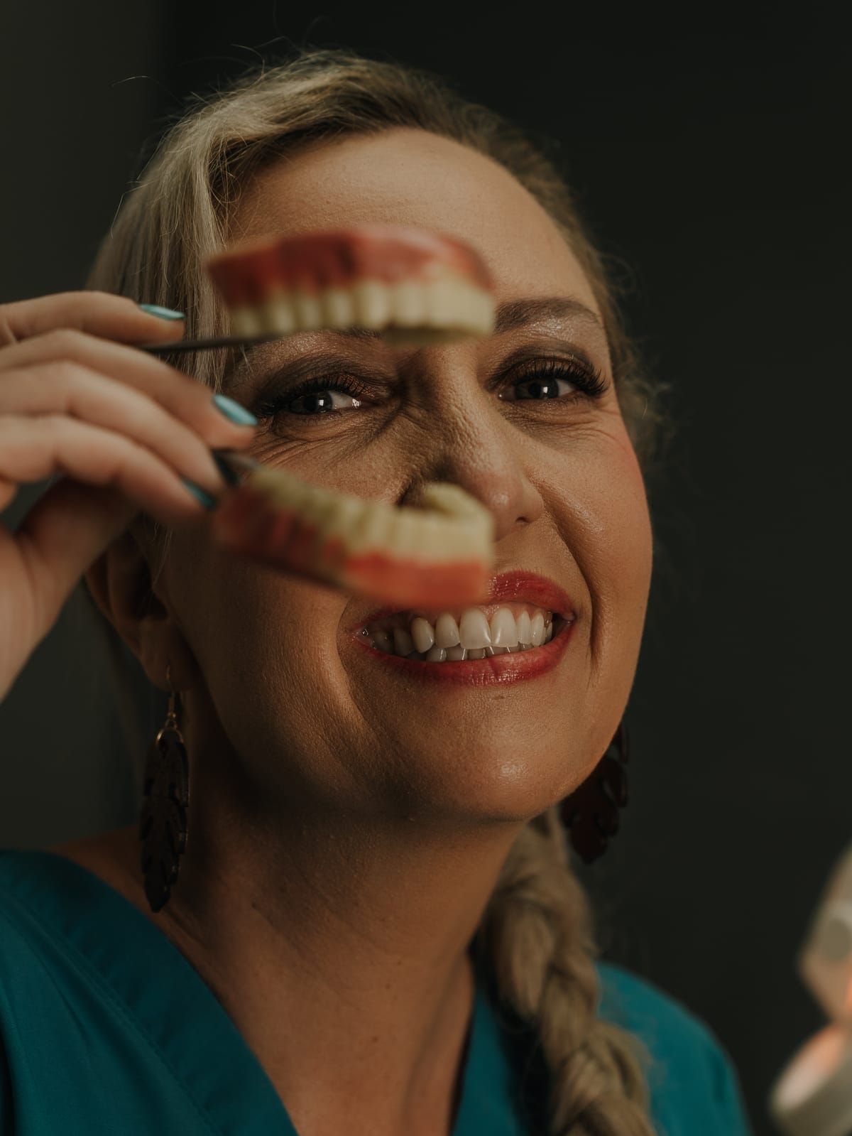 A smiling patient with a bright, healthy smile at Smile Connection Dental Studio, Pretoria